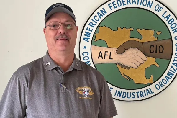 President Brian Alexander before the AFL-CIO logo