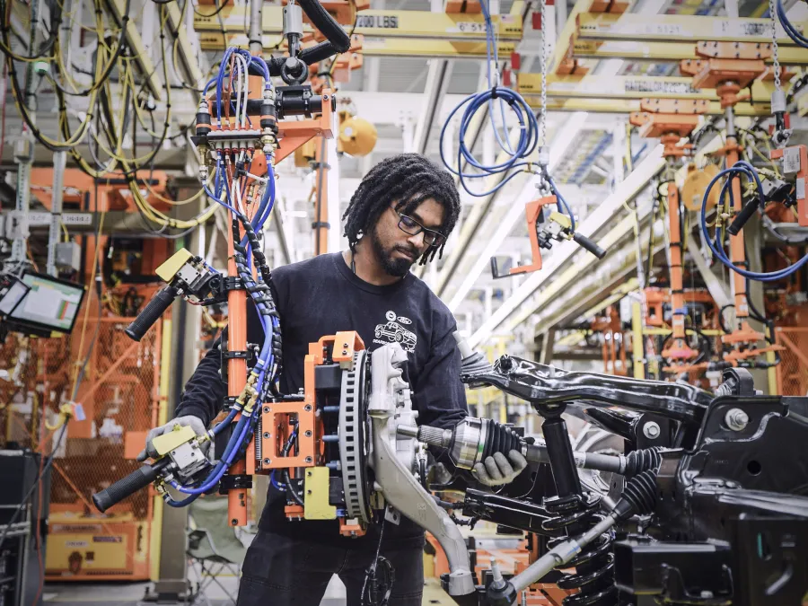 A worker inside an electric vehicle factory